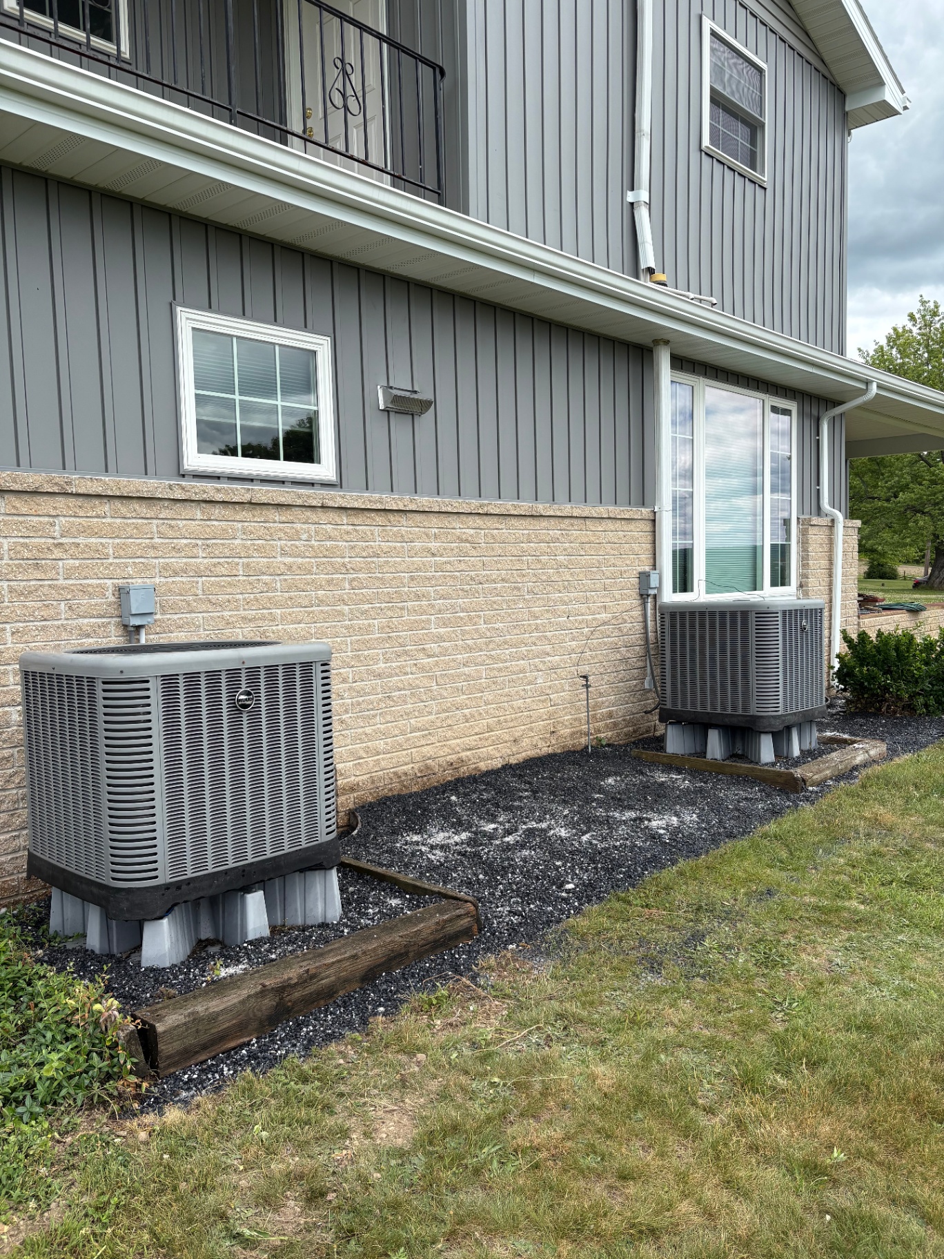 Decorative stone bed around AC units